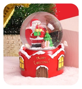 Detailed base showing Merry Christmas text and a miniature house resin carving