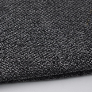 Macro shot of charcoal grey knitted fabric showing premium texture and weave
