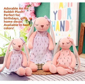Detailed view of pink and purple bunny plush toys with floral dresses in three sizes