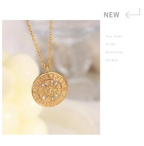 Detailed close-up of 18K gold plated celestial coin pendant with cubic zirconia stones