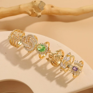 Set of 6 gold plated 14K rings with colorful cubic zirconia in a diagonal layout