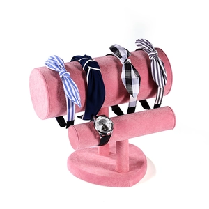 Detail of pink velvet double-layer headband stand showing soft texture and T-bar structure
