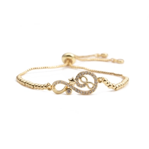 Gold-plated infinity bracelet with star charm, cubic zirconia inlays, and adjustable bead chain