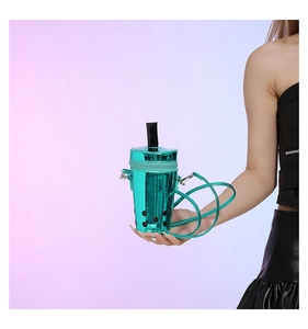 Detail of creative milk tea cup shaped crossbody bag with glossy teal laser finish