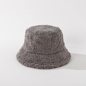 Close-up of thick dark grey faux lamb wool fabric texture on a warm winter bucket hat