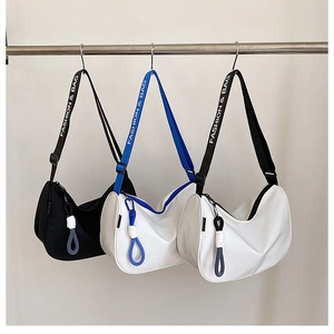 Detailed display of crescent oxford cloth bags with wide adjustable shoulder straps