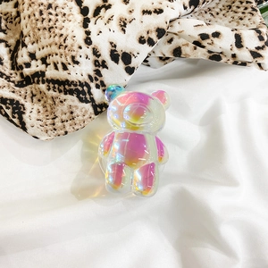 Detailed macro view of 3D holographic bear phone socket with iridescent laser finish effect