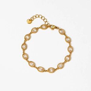 Elegant gold plated bracelet featuring oval cut cubic zirconia and lobster clasp detail