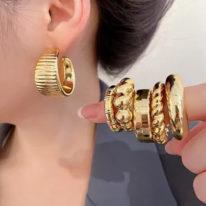 Golden drop earrings and textured ring set featuring pleated geometric designs for women
