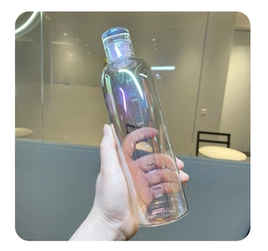 Detail of colorful iridescent water bottle with clear time scale markings and cap