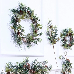 Artificial Christmas wreath and garland set with pine cones for festive holiday wall decor