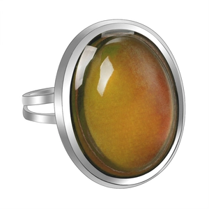 Macro shot of silver adjustable ring with color-changing round cabochon gemstone