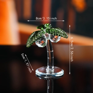 Crystal coconut tree ornament with green leaves and clear trunk on mirror base