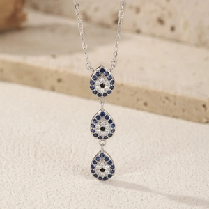 Elegant S925 sterling silver necklace with three blue crystal evil eye pendants