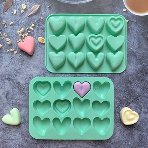 Green heart-shaped silicone chocolate mold with 'Happy' embossed patterns for DIY baking