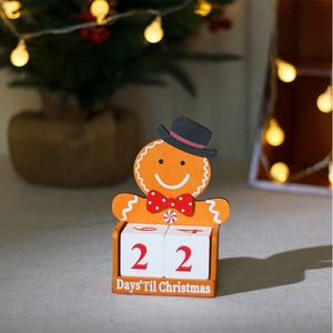Close-up of wooden gingerbread man advent calendar with festive blurred background