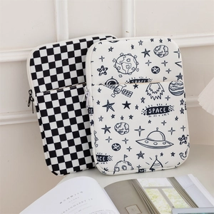 Detail of checkered and space-themed shockproof laptop bags with front zipper pockets