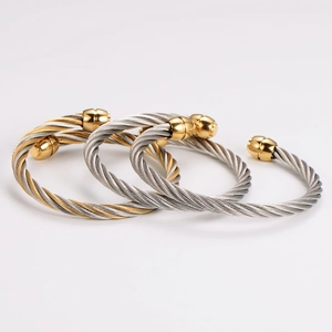 Three-piece set of twisted steel cable bracelets with polished gold spherical end caps