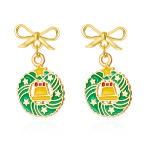 Close-up of festive Christmas wreath earrings with red bow, green leaves and gold bell