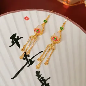 Traditional Chinese style lotus tassel earrings with white gourd charms and gold finish