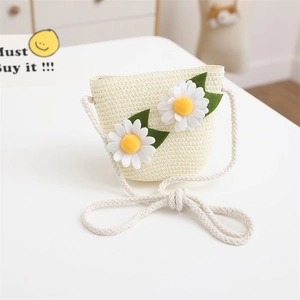 Close-up of beige straw woven crossbody bag for kids featuring daisy flower ornaments