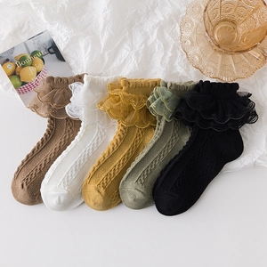 Five pairs of cotton girls' socks with lace trim and cable knit texture in various colors