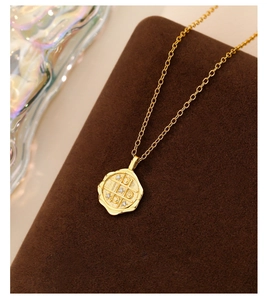 Macro detail of gold geometric s925 silver pendant necklace with zircon inlays