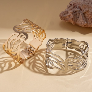 Elegant hollowed leaf pattern metal cuff bracelets in polished gold and silver finishes