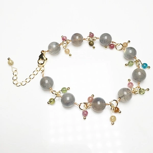 Detailed view of grey labradorite beads bracelet with multi-color tourmaline and gold clasp