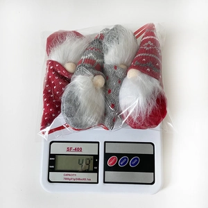 Weight measurement of 49g for a four-piece Christmas forest gnome plush ornament set