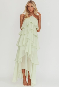 Detailed view of mint green tiered ruffle hem on a halter chiffon evening maxi dress