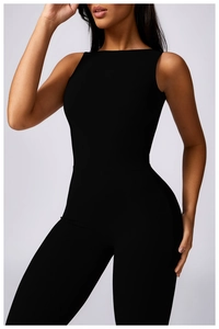 Macro detail of black high-neck sleeveless yoga jumpsuit featuring premium matte finish texture