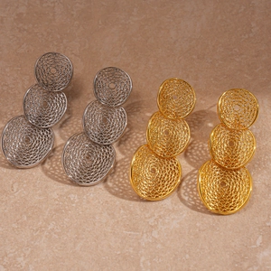 Detailed view of silver and gold layered hollow mesh geometric circular drop earrings