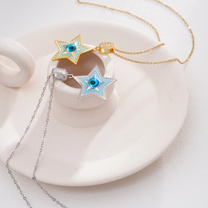 Minimalist star-shaped evil eye pendant necklace with light blue enamel in gold and silver
