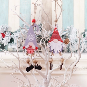 Wooden Christmas gnome hanging ornaments with long beaded legs on white branches