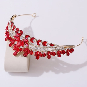 Detail view of gold alloy bridal crown with sparkling red and white crystal rhinestones