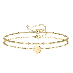 Detail showing gold layered heart bracelet with round charm and lobster clasp