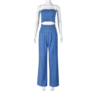 Detail of blue two-piece set featuring pleated cropped tube top and high-waist wide-leg pants