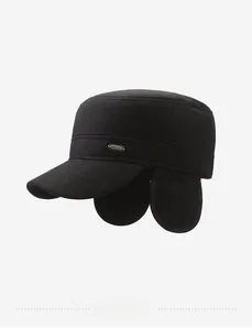 Detail of winter black flat top army cap with ear flaps and metallic fashion plate