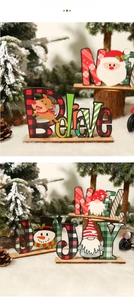 Detalle de adornos navideños de madera Believe con reno y gnomo sobre fondo de nieve