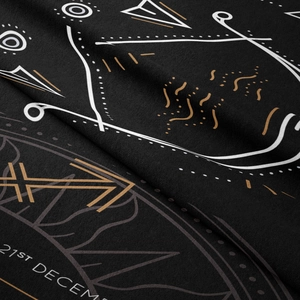 Detailed close-up showing the fine texture and golden astrological print on black tapestry