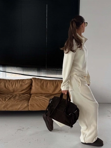 Cream polar fleece two-piece set with half-zip sweatshirt and wide-leg trousers in casual style