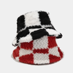 Close-up of checkerboard plush bucket hats showing soft faux fur texture in black and red