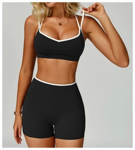 Detail of high-stretch color-block sports bra and high-waist shorts for fitness yoga