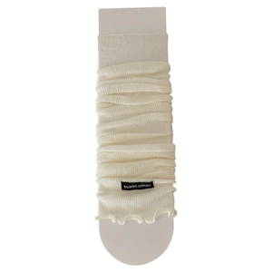 Creamy white ribbed knit leg warmers with lettuce edge trim and minimalist fabric brand label