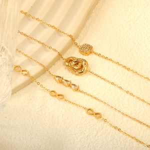 French vintage gold bracelets set with geometric pendants and sparkling zircons