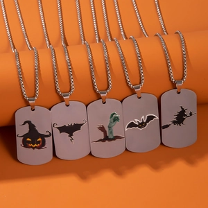 Halloween stainless steel tag necklaces with pumpkin, witch, and bat patterns on orange