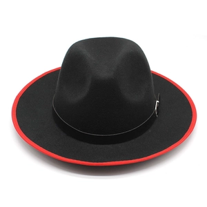 Close-up of black wool fedora featuring red piping and leather band with metal buckle