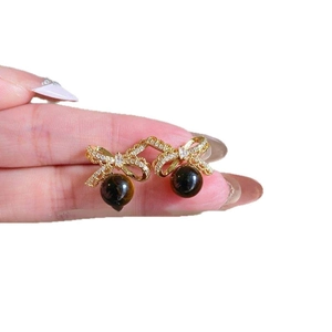 18K gold-plated bow earrings featuring zircon accents and brown tiger eye stone drops