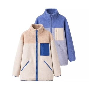 Detail view of fleece jacket featuring stand collar and contrast zip pocket design